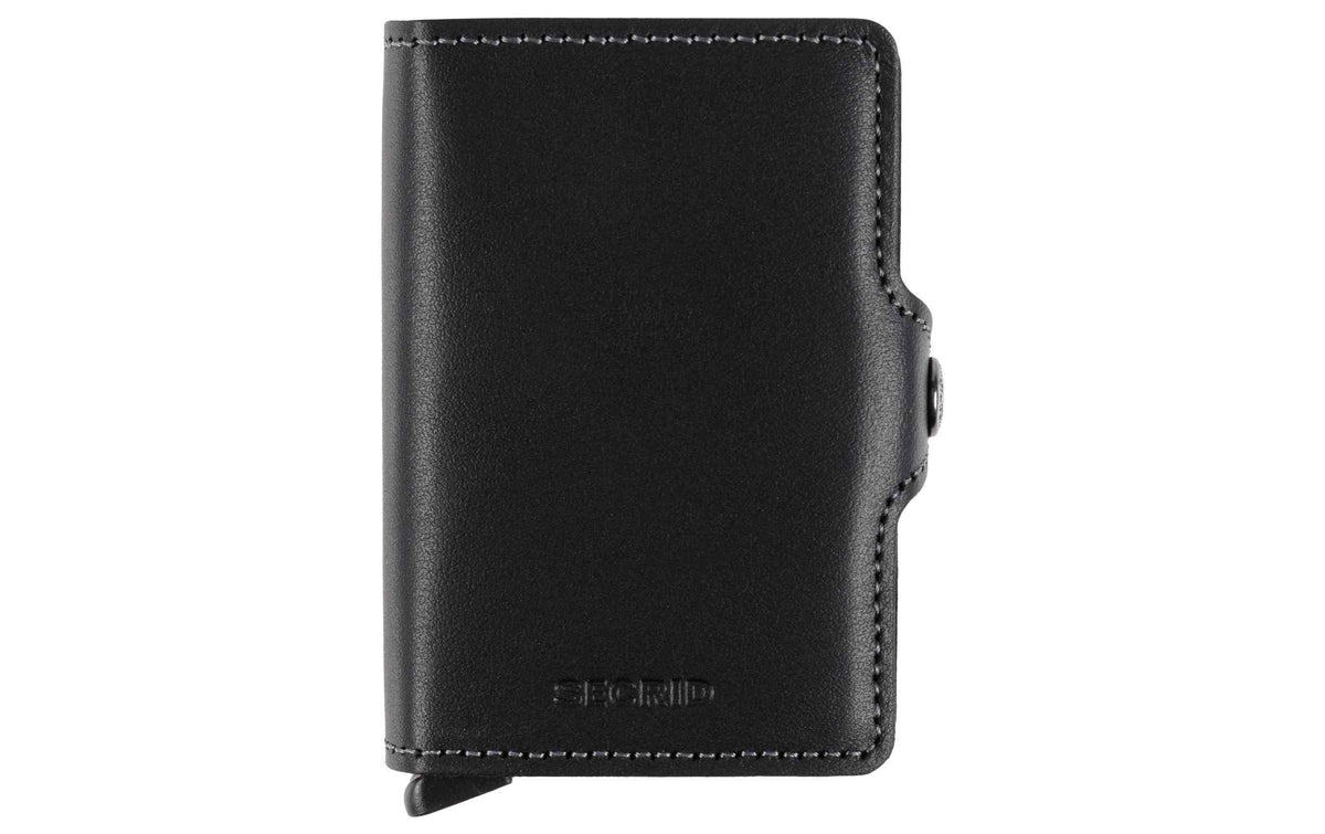 SECRID Twinwallet aus schwarzem Leder mit Druckknopfverschluss und dezenter Logo-Prägung.